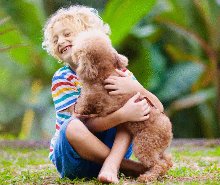 Child playing with a puppy